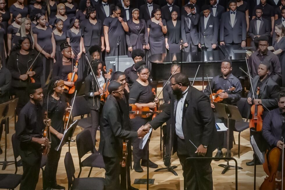 STAFF SPOTLIGHT: Demetrius Robinson demetrius and students shaking hands 980x653 1